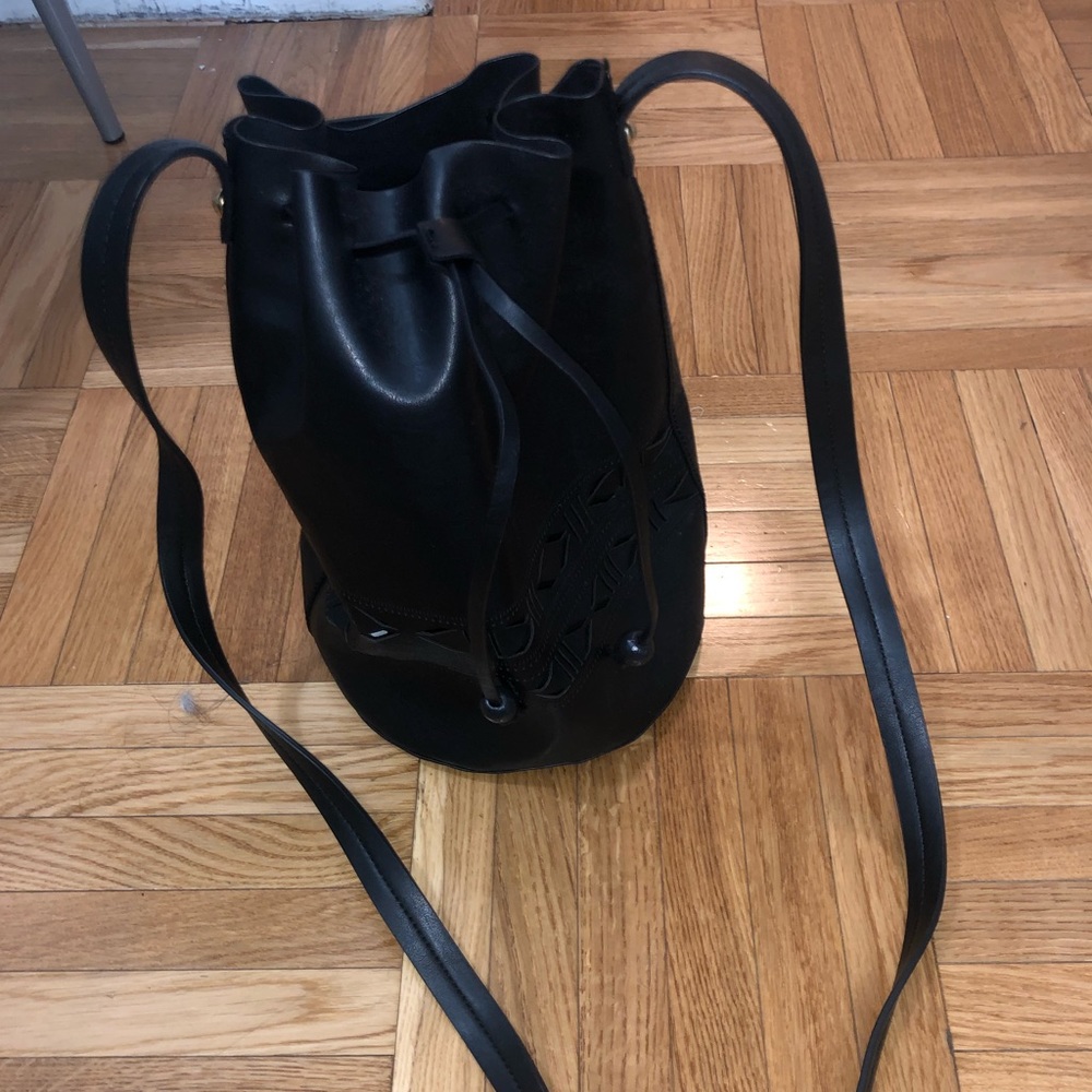 Black leather bucket bag with cutout detailing